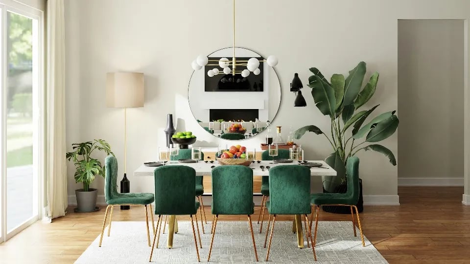 Modern dining room with green velvet chairs and decorative indoor plants.